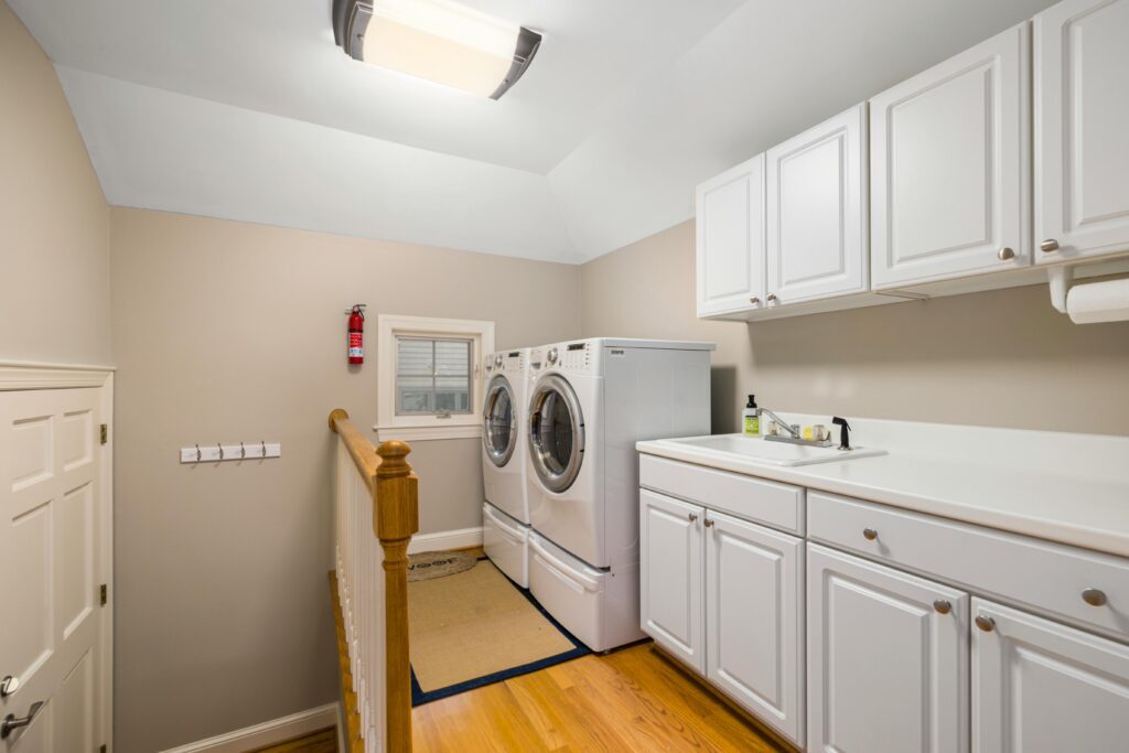 Laundry room with lots of lower storage cabinets.